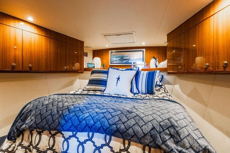 Slide: The Image of Luxurious cabin interior of 2020 Viking 46 Billfish yacht with elegant bedding and wood cabinetry. - 15