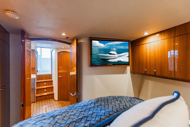 Slide: The Image of Luxurious interior of 2020 Viking 46 Billfish yacht with wood paneling and TV. - 16