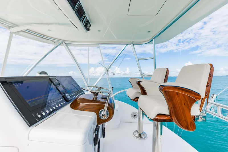 Slide: The Image of Luxurious 2020 Viking 46 Billfish yacht helm with ocean view and modern controls. - 19