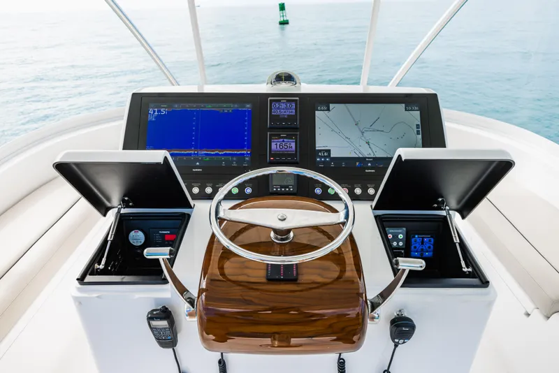 Slide: The Image of Viking 46 Billfish 2020 helm with advanced navigation displays and controls. - 22