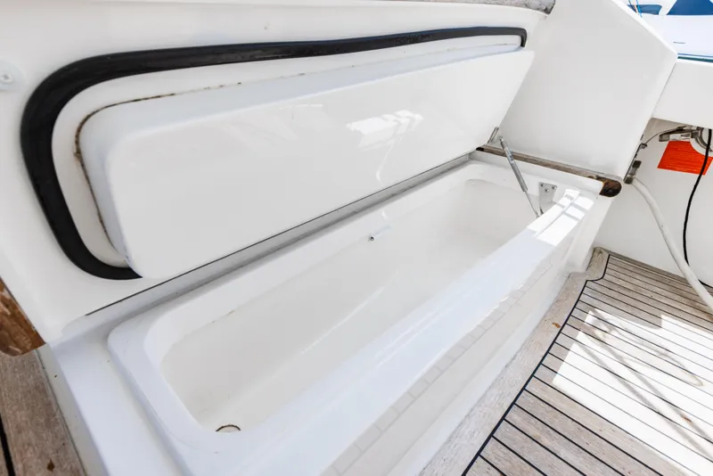 Slide: The Image of Open storage compartment on 2020 Viking 46 Billfish boat deck. - 29