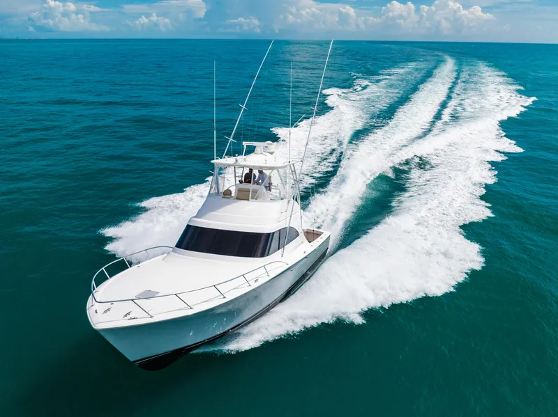 Slide: The Image of 2020 Viking 46 Billfish yacht cruising on open ocean waters. - 30