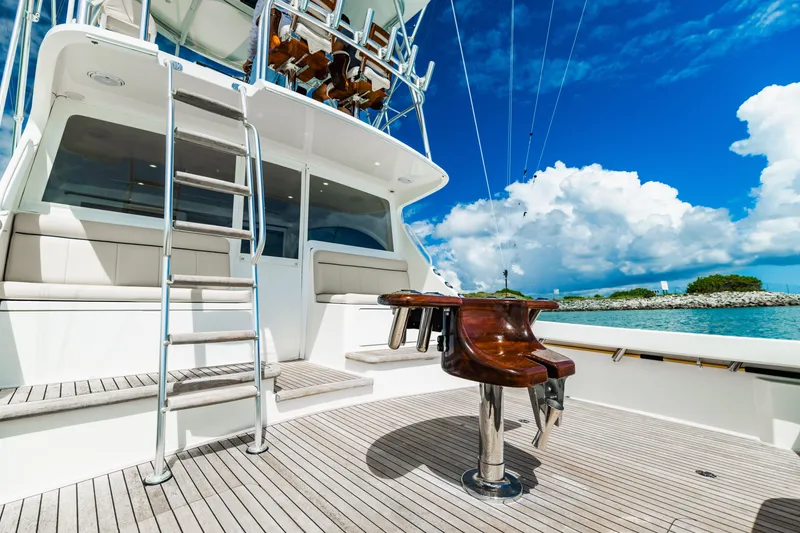 Slide: The Image of Viking 46 Billfish 2020 yacht deck with ladder and seating under blue sky. - 7