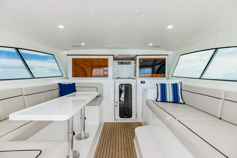 Slide: The Image of Luxurious interior of 2020 Viking 46 Billfish yacht with seating and table. - 8