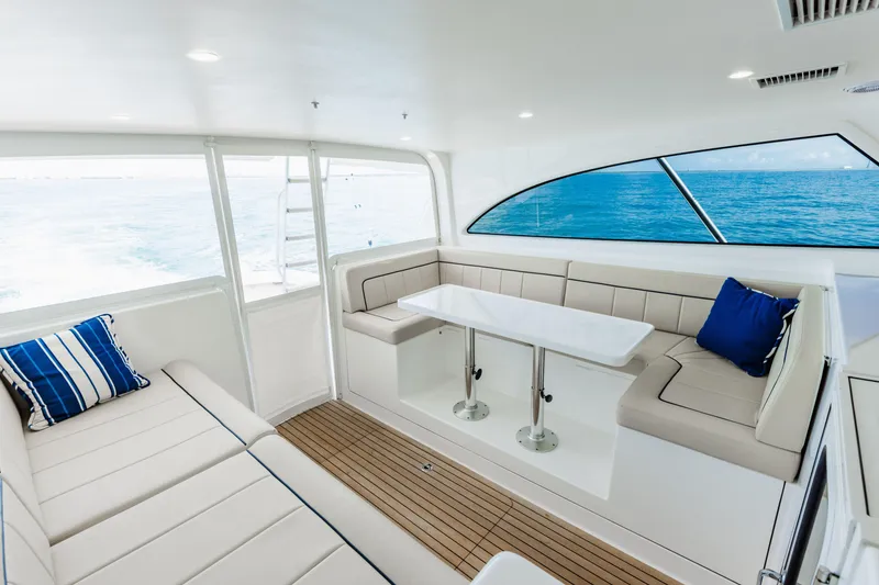 Slide: The Image of Luxurious interior of 2020 Viking 46 Billfish yacht with ocean view and plush seating. - 9