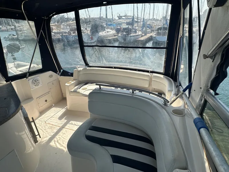Slide: The Image of Interior of 2004 Rinker Fiesta Vee 312 boat with marina view. - 4