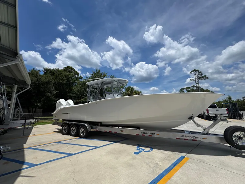 Slide: The Image of 2026 Cape Horn 34 XS boat on trailer under blue sky. - 10