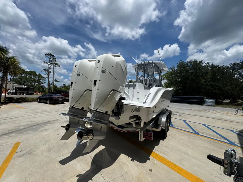 Slide: The Image of 2026 Cape Horn 34 XS boat with dual outboard motors on a trailer. - 14