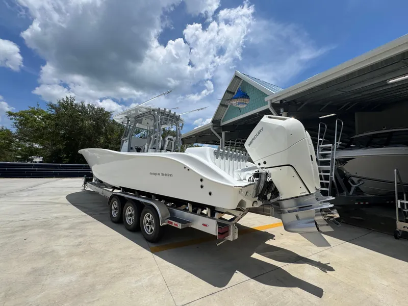 Slide: The Image of 2026 Cape Horn 34 XS boat on trailer under blue sky. - 18