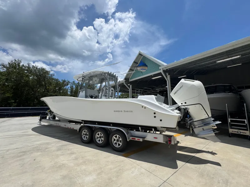 Slide: The Image of 2026 Cape Horn 34 XS boat on trailer under cloudy sky. - 19