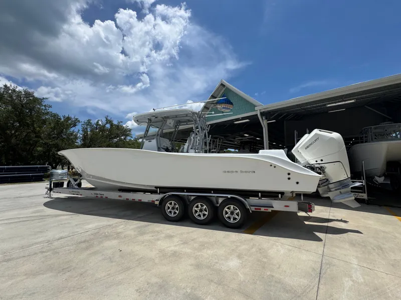 Slide: The Image of 2026 Cape Horn 34 XS boat on trailer under clear blue sky. - 20