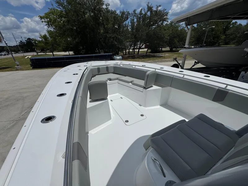 Slide: The Image of 2026 Cape Horn 34 XS boat interior with seating, under a clear sky. - 23