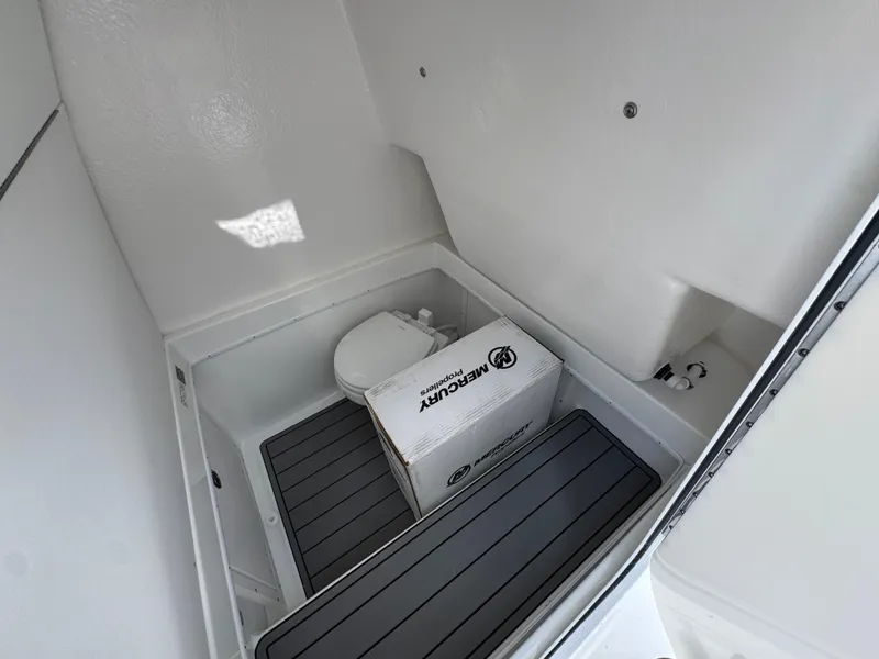 Slide: The Image of 2026 Cape Horn 34 XS boat interior with toilet and Mercury box. - 29