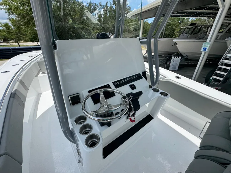 Slide: The Image of 2026 Cape Horn 34 XS boat helm with steering wheel and control panel. - 30