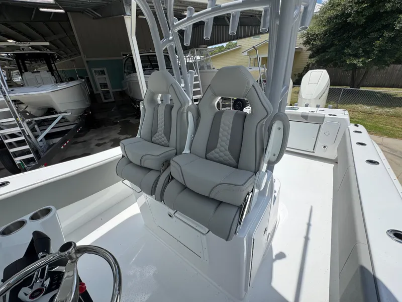 Slide: The Image of 2026 Cape Horn 34 XS boat interior with dual gray seats and steering wheel. - 33