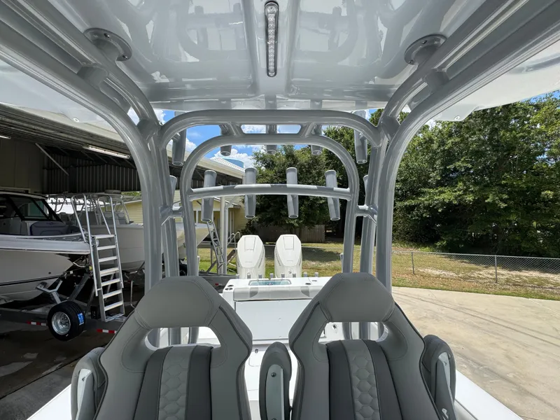 Slide: The Image of 2026 Cape Horn 34 XS boat interior with sleek seating and rod holders. - 35