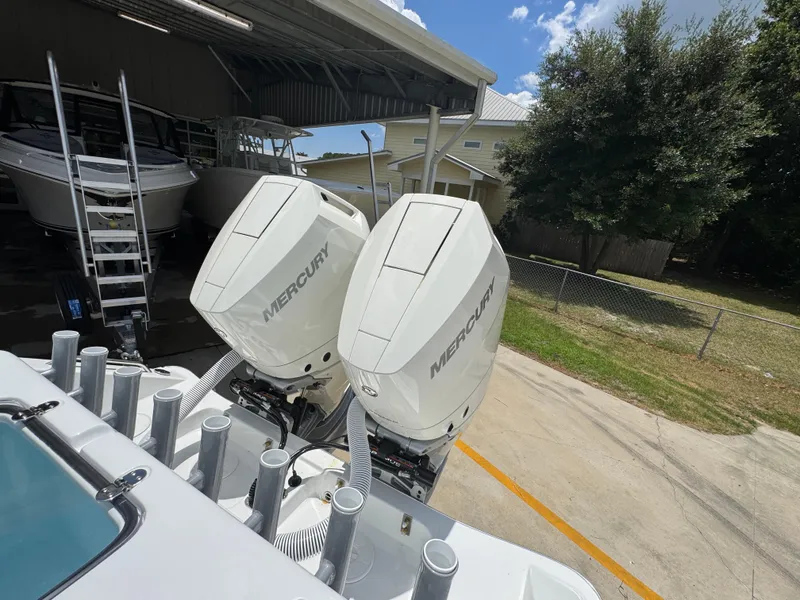 Slide: The Image of 2026 Cape Horn 34 XS with dual Mercury outboard engines in a boatyard. - 41