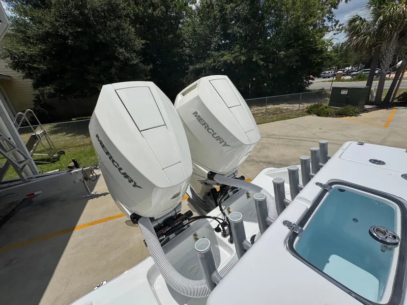 Slide: The Image of 2026 Cape Horn 34 XS boat with dual Mercury outboard engines in a sunny outdoor setting. - 42