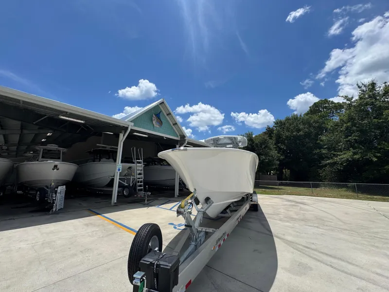 Slide: The Image of 2026 Cape Horn 34 XS boat on trailer under clear blue sky. - 6