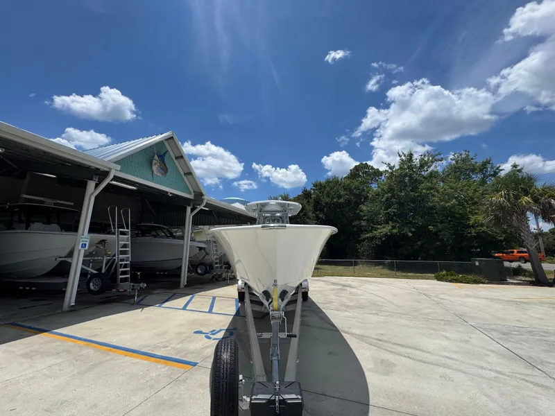 Slide: The Image of 2026 Cape Horn 34 XS boat on trailer under clear blue sky. - 7