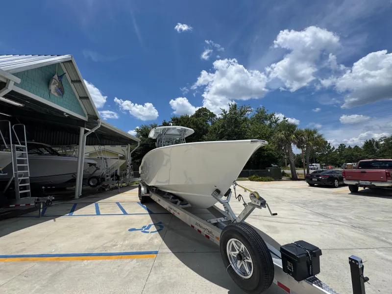 Slide: The Image of 2026 Cape Horn 34 XS boat on trailer under clear blue sky. - 8