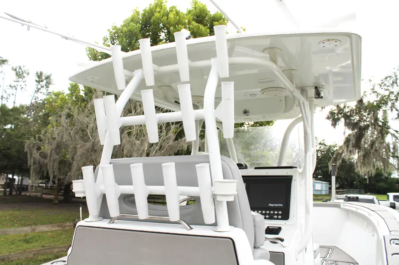 Slide: The Image of 2005 Yellowfin 31 Open boat with rod holders and navigation equipment. - 33