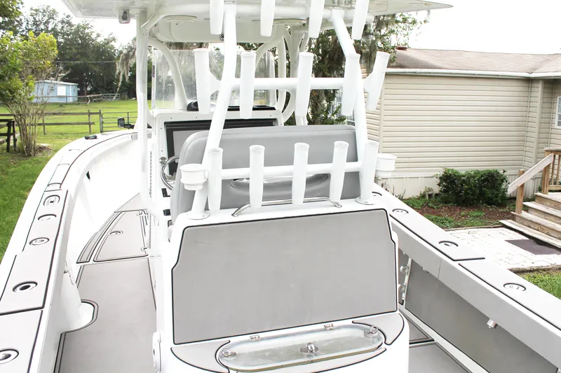 Slide: The Image of 2005 Yellowfin 31 Open boat with rod holders, sleek design, and spacious deck. - 34