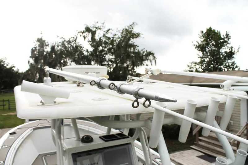 Slide: The Image of 2005 Yellowfin 31 Open boat with fishing rod holders and equipment on deck. - 35