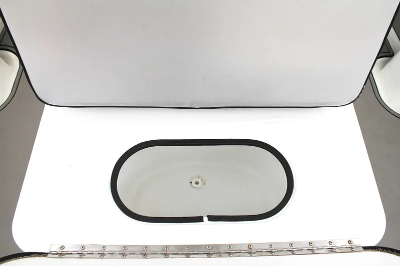 Slide: The Image of Open storage compartment on a 2005 Yellowfin 31 Open boat. - 38