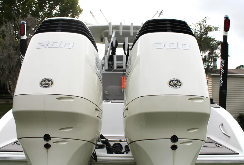 Slide: The Image of 2005 Yellowfin 31 Center Console boat on calm water, side view. - 6