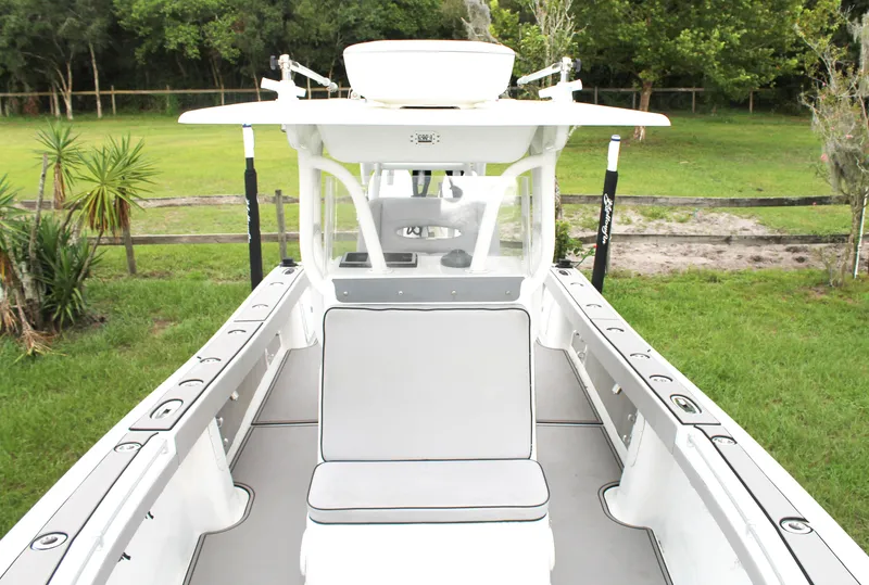 Slide: The Image of 2005 Yellowfin 31 Center Console boat with dual Suzuki 300 engines on water. - 7