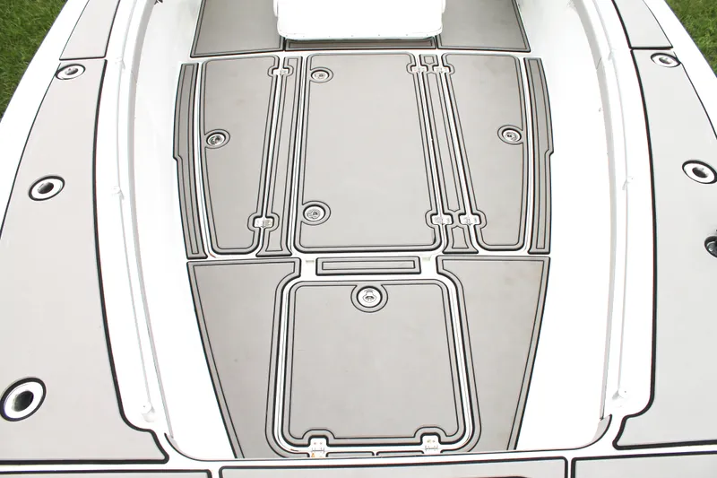 Slide: The Image of 2005 Yellowfin 31 Open boat on trailer, parked on grass. - 9