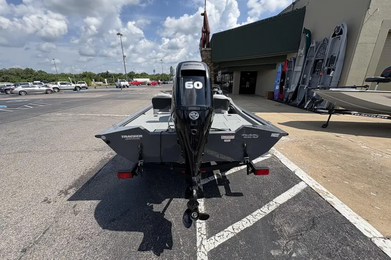Slide: The Image of 2016 Tracker Pro Team 175 TF boat with 60 HP engine in parking lot. - 2