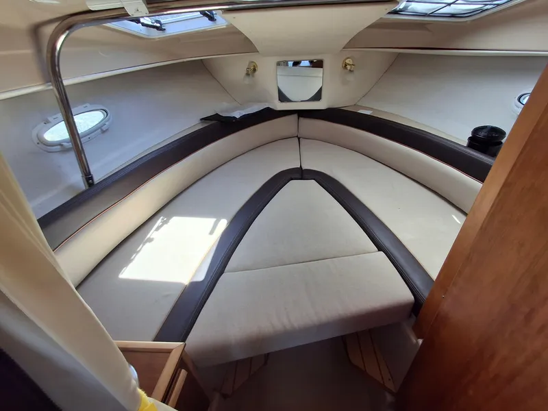 Slide: The Image of Interior cabin of a 2017 Cutwater C24 boat with cushioned seating. - 16
