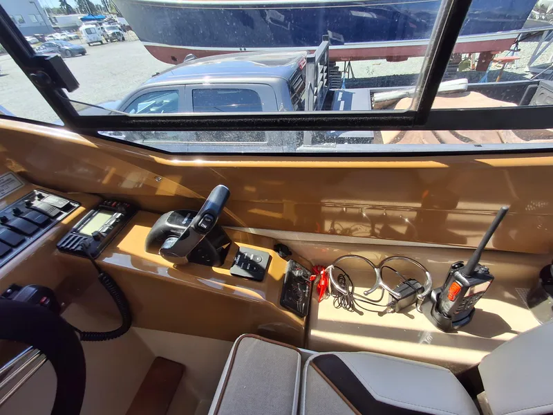 Slide: The Image of Interior view of a 2017 Cutwater C24 boat cockpit with controls and communication devices. - 21