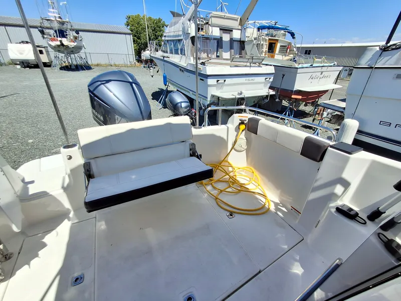 Slide: The Image of 2017 Cutwater C24 boat deck with seating and yellow power cable. - 28