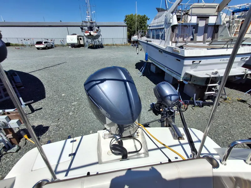 Slide: The Image of 2017 Cutwater C24 boat with outboard motor in a marina storage area. - 29