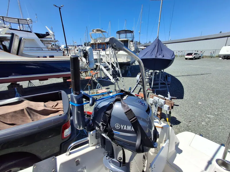 Slide: The Image of 2017 Cutwater C24 boat with Yamaha motor in a marina setting. - 30