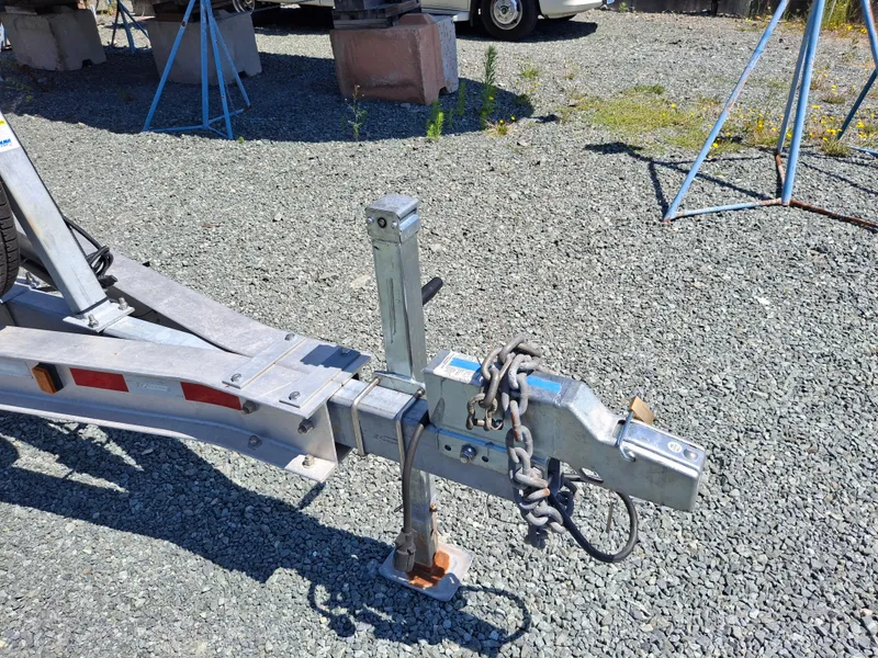 Slide: The Image of Trailer hitch of a 2017 Cutwater C24 boat on gravel surface. - 36