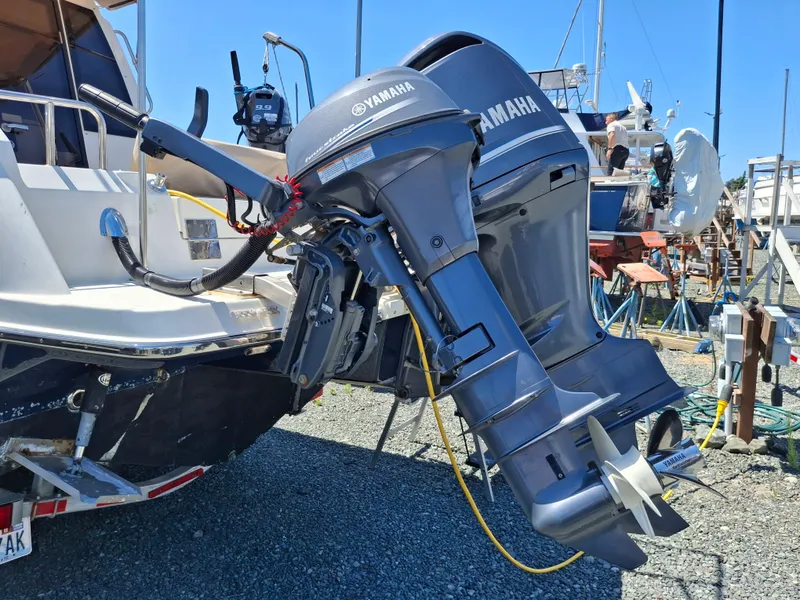 Slide: The Image of 2017 Cutwater C24 boat with Yamaha outboard motors in a marina setting. - 4