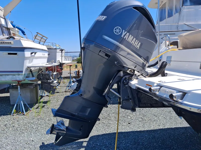 Slide: The Image of 2017 Cutwater C24 with Yamaha outboard motor in a boatyard setting. - 5