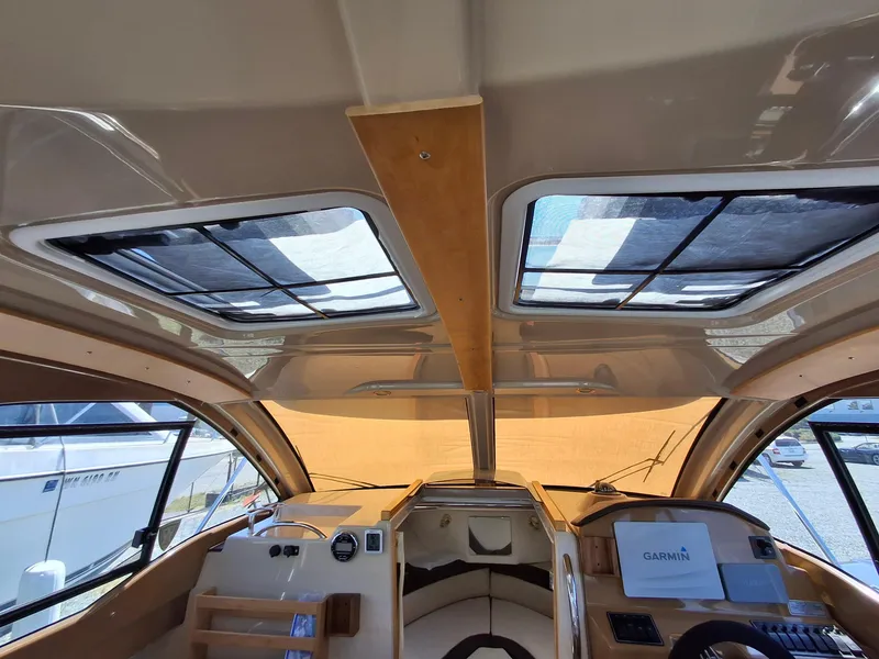 Slide: The Image of Interior view of 2017 Cutwater C24 boat with sunroof and Garmin navigation system. - 9