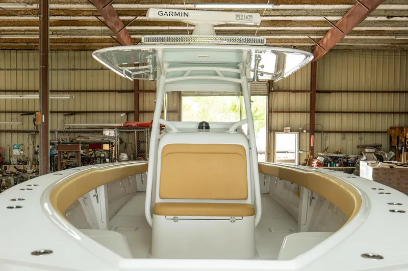 Slide: The Image of 2020 Bahama 41 Open Fisherman boat interior in a warehouse. - 11