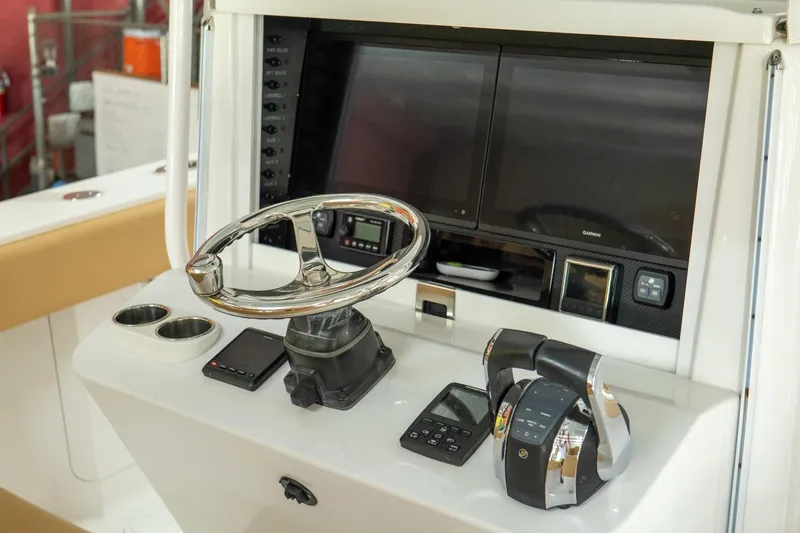 Slide: The Image of 2020 Bahama 41 Open Fisherman boat helm with modern controls and dual screens. - 6