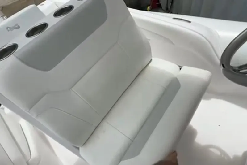 Slide: The Image of 2023 Airship 310-Rib inflatable boat docked near a building and parked van. - 13