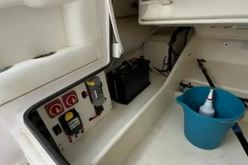 Slide: The Image of 2023 Airship 310-Rib boat interior with white seating and Mercury engine. - 28