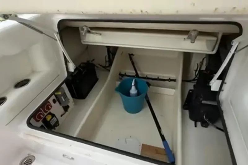 Slide: The Image of 2023 Airship 310-Rib boat docked at a scenic waterfront with lush greenery. - 29