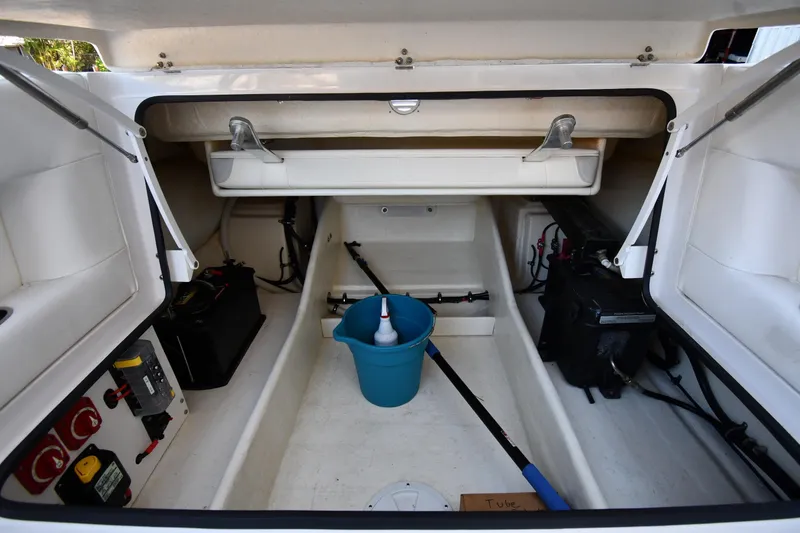 Slide: The Image of Open storage compartment of 2023 Airship 310-Rib boat with equipment and supplies. - 30