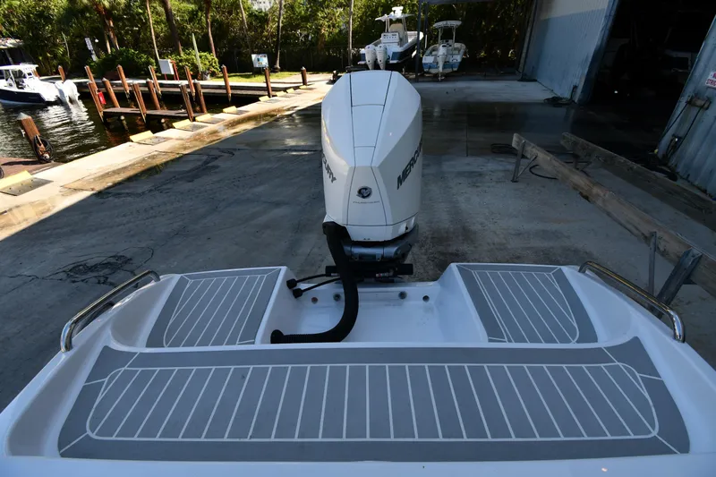 Slide: The Image of 2023 Airship 310-Rib boat with Mercury outboard engine at dockside. - 33