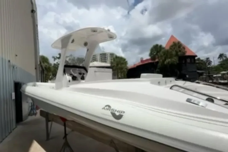 Slide: The Image of 2023 Airship 310-Rib boat in storage, showcasing sleek design and modern features. - 5
